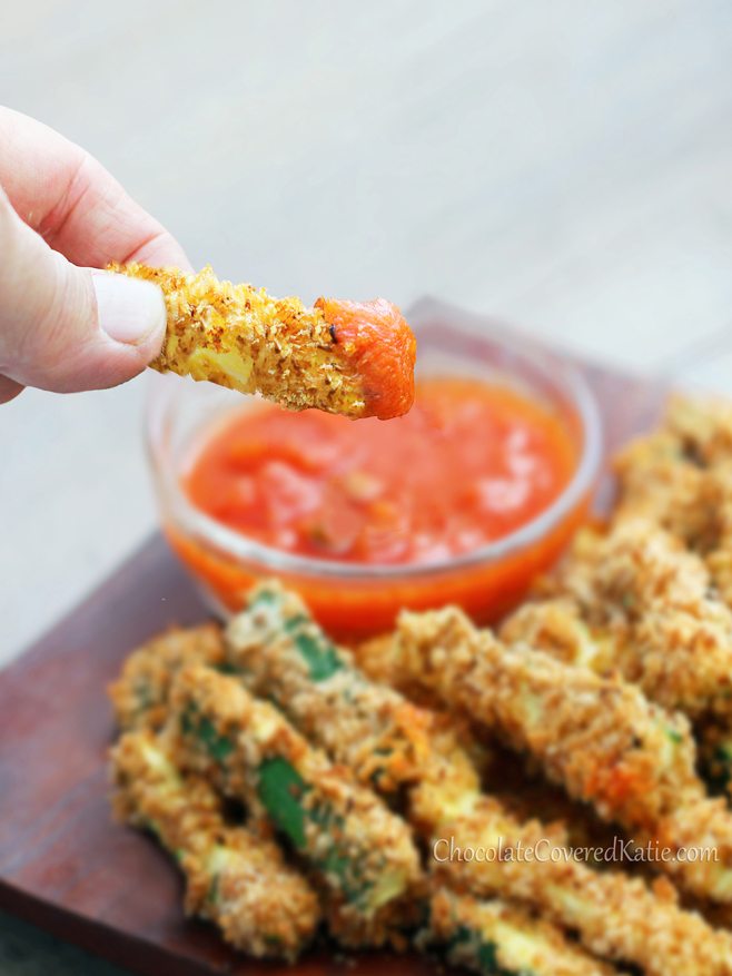 CRISPY baked zucchini fries - from @choccoveredkt - With a crispy "junk food" taste, these are so healthy you can eat a huge serving! https://chocolatecoveredkatie.com/2013/05/28/crispy-healthy-baked-zucchini-fries/