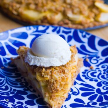 Flaky homemade pie crust, sweet cinnamon apples, and buttery oatmeal crumble – This homestyle Dutch apple pie is good beyond words! https://chocolatecoveredkatie.com/ @choccoveredkt