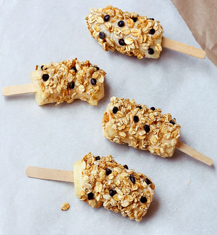 Healthy Snack Banana Popsicles with mini chocolate chips and granola