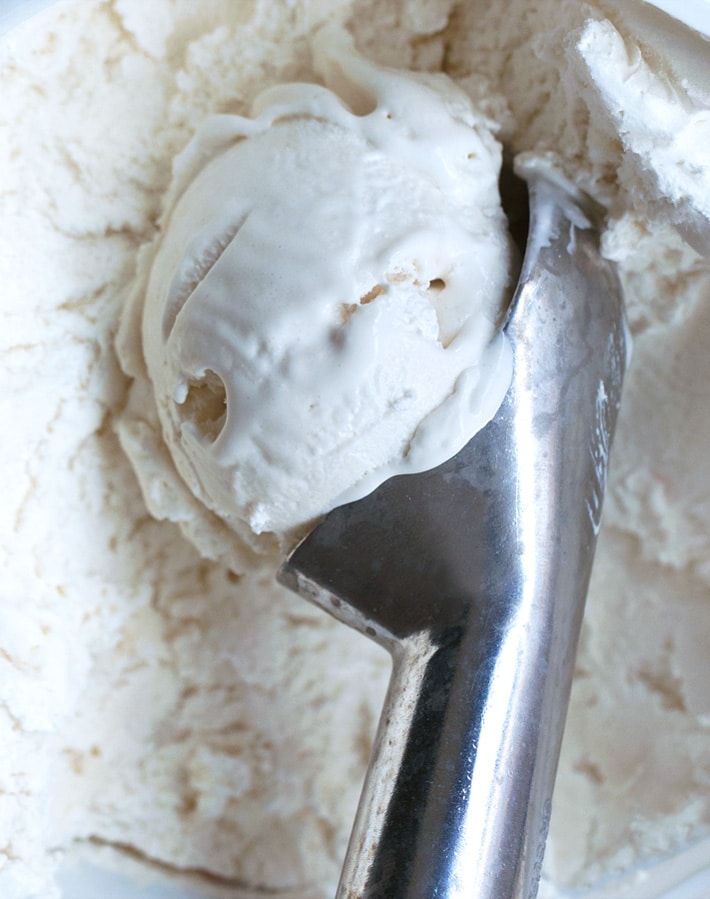 Tasty Homemade Ice Creams Pop With Sticks In Containers On Grey