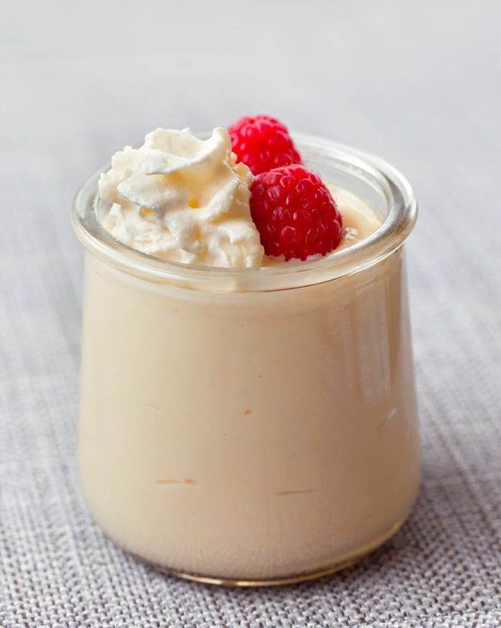 Vegan Mousse Dessert Cups with whipped cream and raspberries