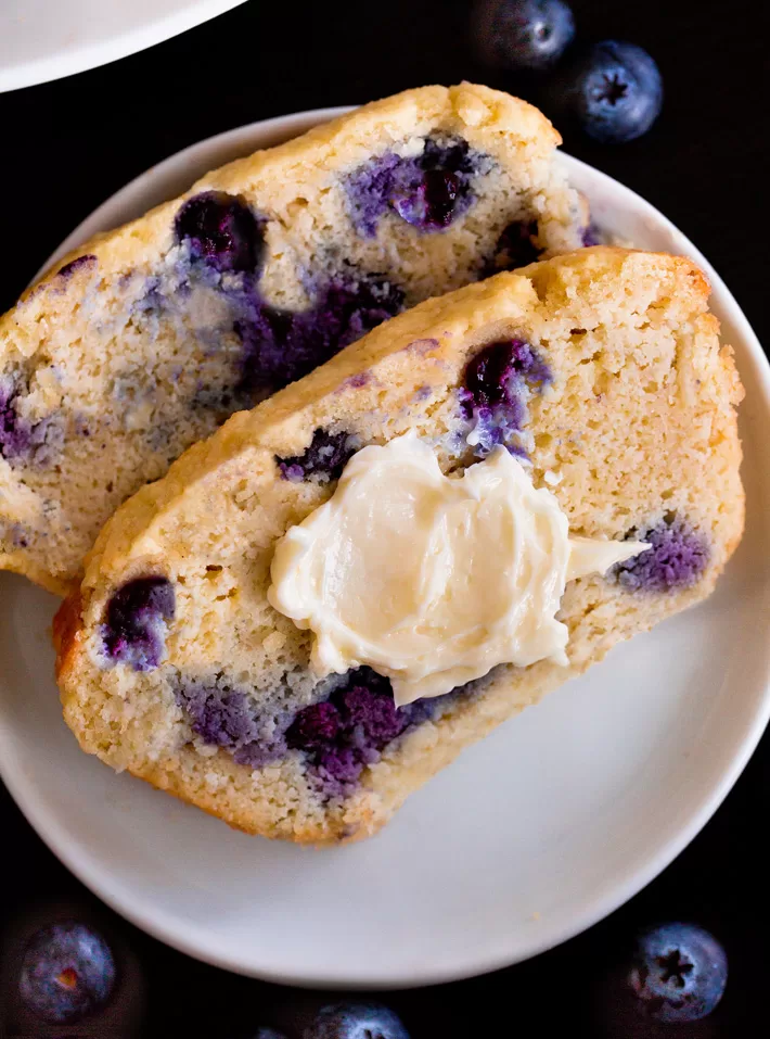 Slice of keto blueberry bread with butter