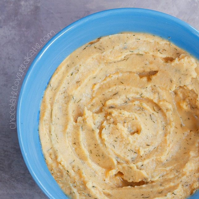 Homemade hummus recipe that tastes surprisingly like Cool Ranch Doritos! Recipe link: https://chocolatecoveredkatie.com/2015/05/28/cool-ranch-hummus/ 