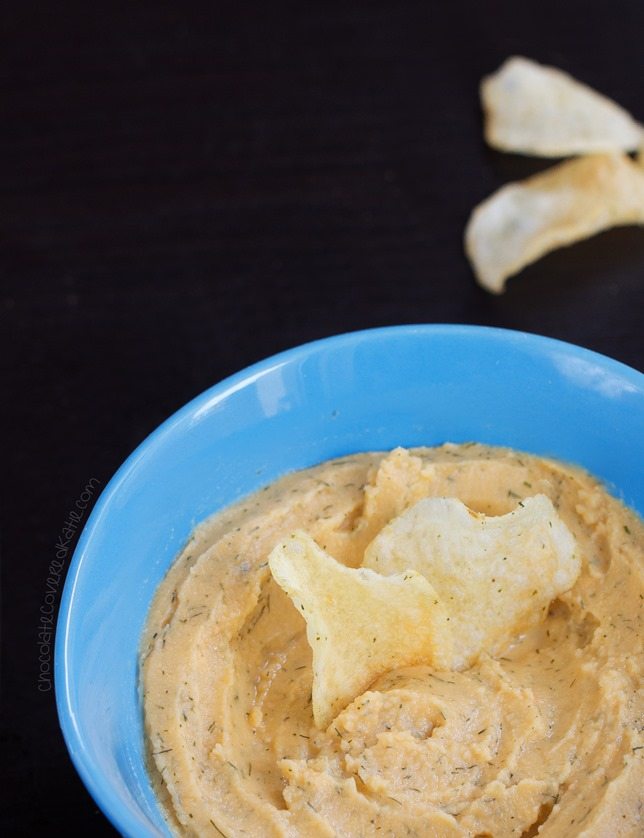 Homemade hummus recipe that tastes surprisingly like Cool Ranch Doritos! Recipe link: https://chocolatecoveredkatie.com/2015/05/28/cool-ranch-hummus/ 