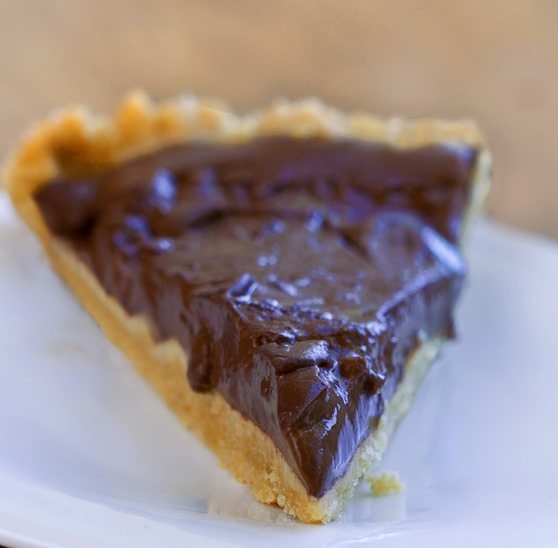 Rich, creamy, thick, chocolatey, gooey chocolate pudding pie... no crazy ingredients + no baking required! https://chocolatecoveredkatie.com/2015/07/23/homemade-chocolate-pudding-pie-no-tofu/ @choccoveredkt 