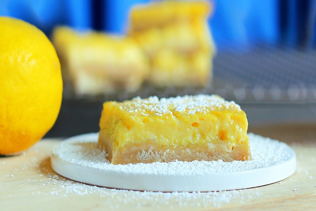 Soft homemade lemon squares from @choccoveredkt that have been described by readers as being "the best lemon bar recipe of all time... healthy or not!" Full recipe here: https://chocolatecoveredkatie.com/2012/05/07/healthy-lemon-squares/
