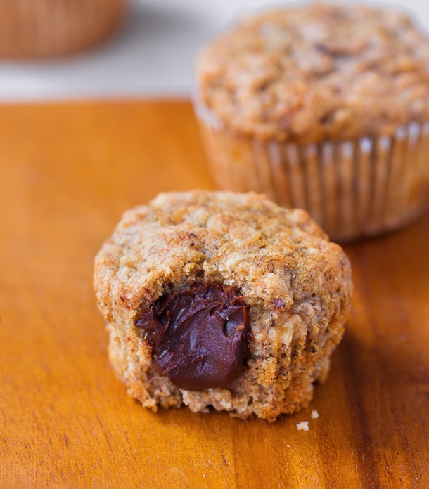 Banana Bread Nutella Muffins – soft and fluffy banana bread muffins... with a secret Nutella filling… https://chocolatecoveredkatie.com/2015/11/05/nutella-muffins/ from @choccoveredkt