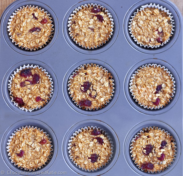 Featured by Fitness Magazine - customizable ”breakfast” oatmeal cupcakes from @choccoveredkt, Great on-the-go fuel on rushed mornings + Can be frozen for later. Full recipe: https://chocolatecoveredkatie.com/2015/01/08/go-breakfast-oatmeal-trail-mix-cupcakes/