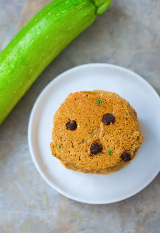 A giant stack of extra fluffy zucchini pancakes, stuffed with melty gooey chocolate chips and covered in hot maple syrup - These disappear so quickly whenever I make them: https://chocolatecoveredkatie.com/2015/08/10/zucchini-pancakes-healthy-vegan/