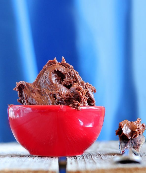 Chocolate frosting that is actually GOOD for you - @choccoveredkt https://chocolatecoveredkatie.com/2012/05/04/reeses-pieces-fudge-frosting/